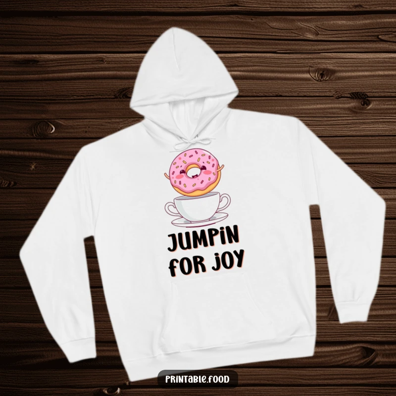 Funny Hoodie featuring a giggling donut with sprinkles jumping over a teacup, offering cozy comfort and sweet style.