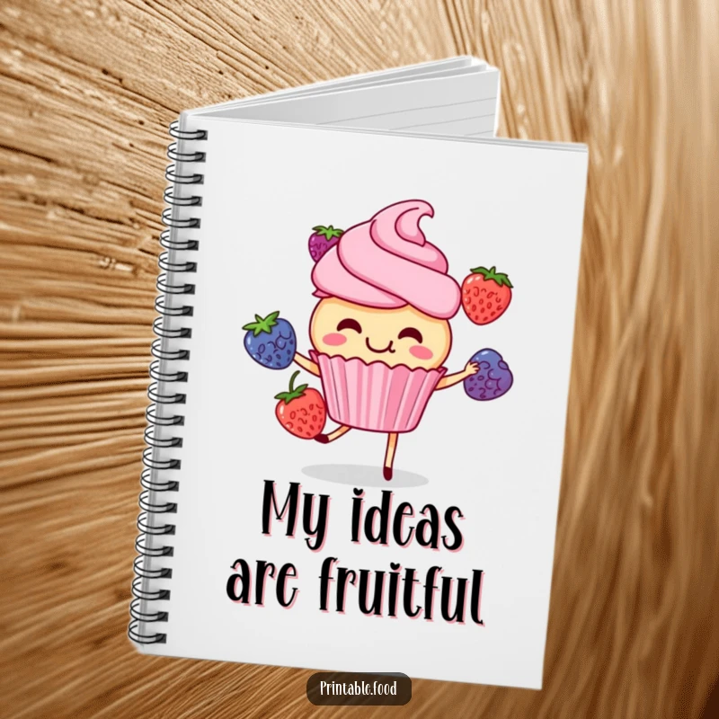 Funny cupcake character giggling while juggling berries, on a notebook cover, inspiring sweet and cheerful note-taking.